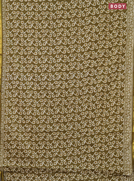 Muslin cotton saree mehendi green with allover prints and zari woven border