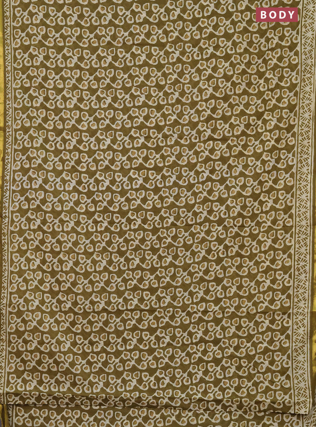 Muslin cotton saree mehendi green with allover prints and zari woven border