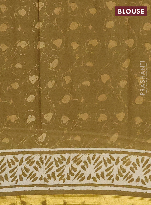 Muslin cotton saree mehendi green with allover prints and zari woven border