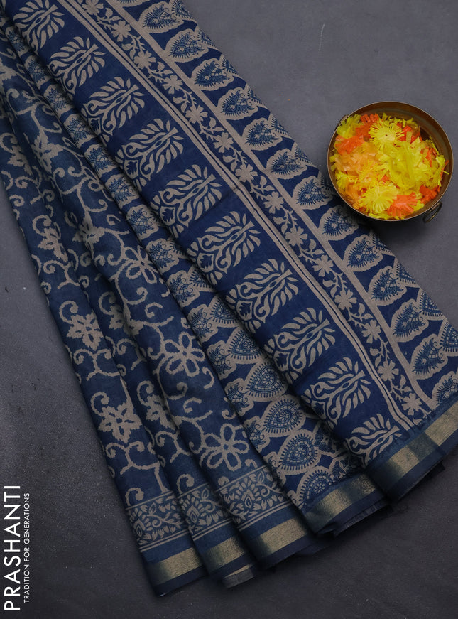Muslin cotton saree peacock blue with allover prints and zari woven border
