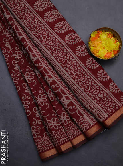 Muslin cotton saree maroon with allover prints and zari woven border