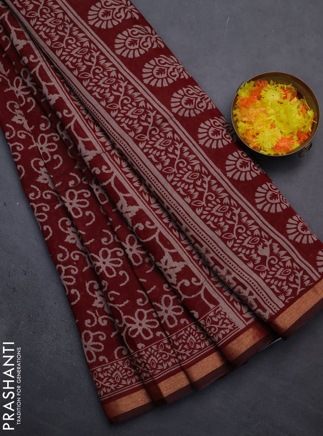 Muslin cotton saree maroon with allover prints and zari woven border