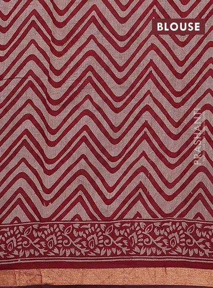 Muslin cotton saree maroon with allover prints and zari woven border
