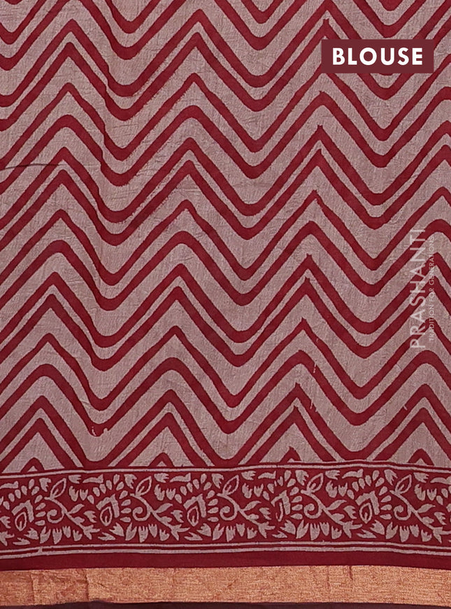 Muslin cotton saree maroon with allover prints and zari woven border