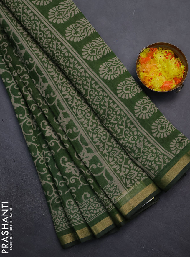 Muslin cotton saree green with allover prints and zari woven border