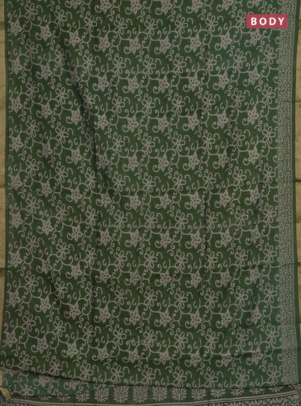 Muslin cotton saree green with allover prints and zari woven border