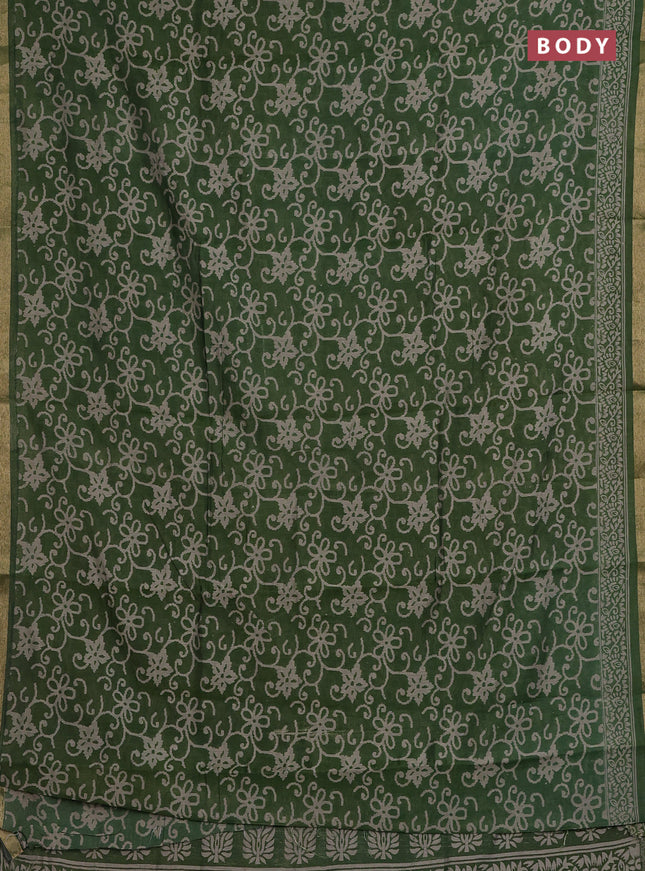 Muslin cotton saree green with allover prints and zari woven border