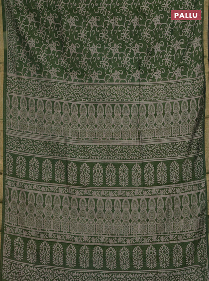 Muslin cotton saree green with allover prints and zari woven border