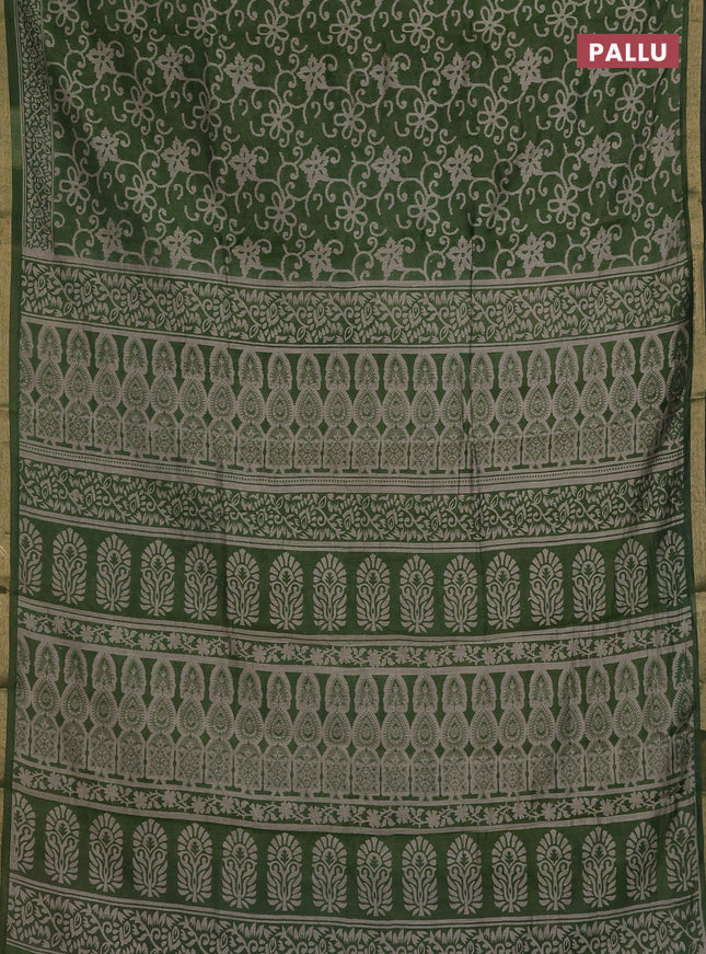 Muslin cotton saree green with allover prints and zari woven border