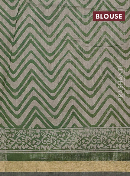 Muslin cotton saree green with allover prints and zari woven border