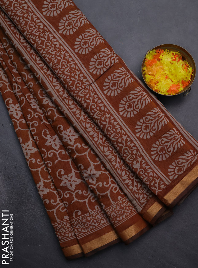 Muslin cotton saree dark mustard with allover prints and zari woven border