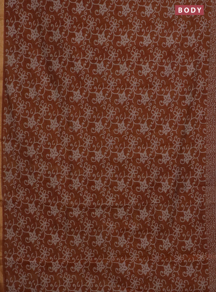 Muslin cotton saree dark mustard with allover prints and zari woven border