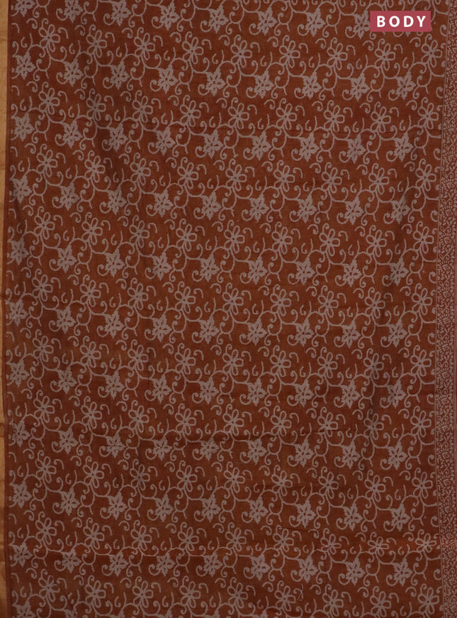 Muslin cotton saree dark mustard with allover prints and zari woven border