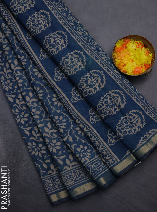 Muslin cotton saree peacock blue with allover prints and zari woven border