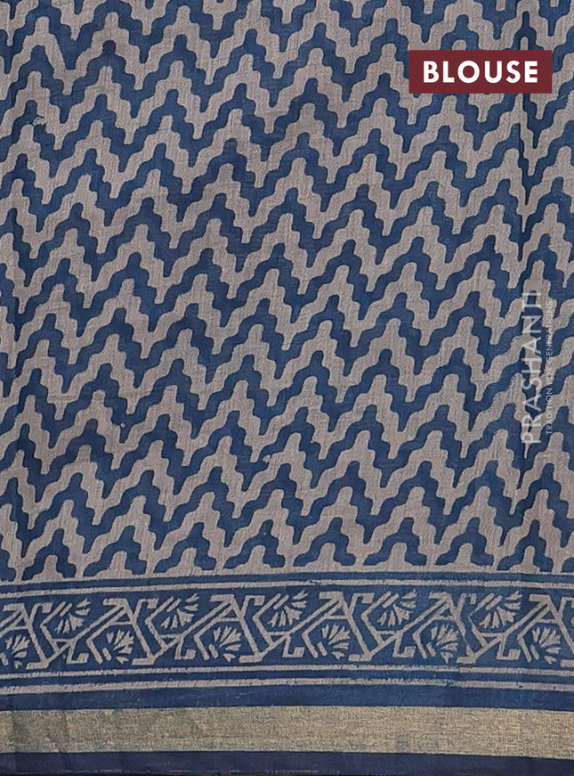 Muslin cotton saree peacock blue with allover prints and zari woven border