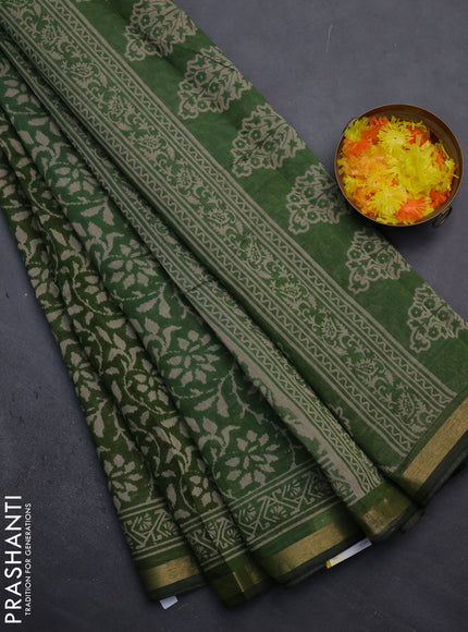 Muslin cotton saree green with allover prints and zari woven border
