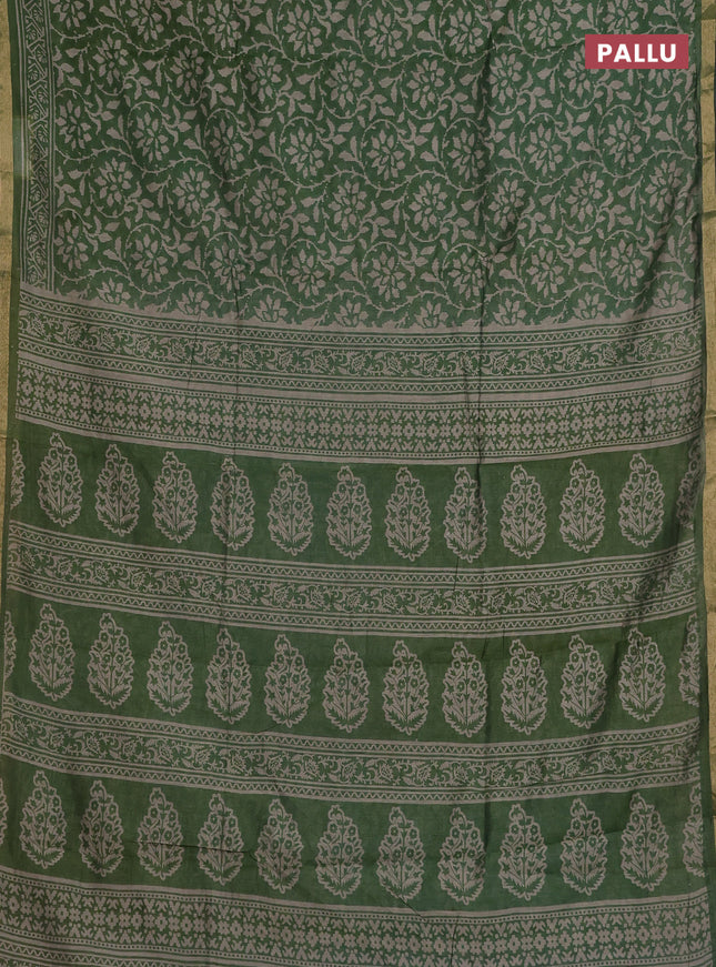 Muslin cotton saree green with allover prints and zari woven border