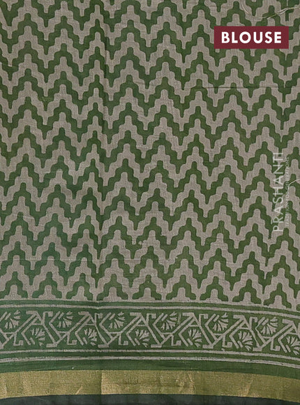 Muslin cotton saree green with allover prints and zari woven border