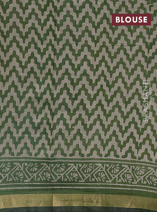 Muslin cotton saree green with allover prints and zari woven border