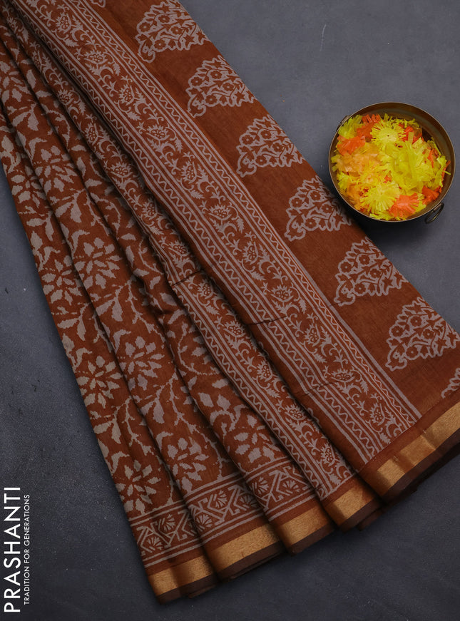 Muslin cotton saree dark mustard with allover prints and zari woven border