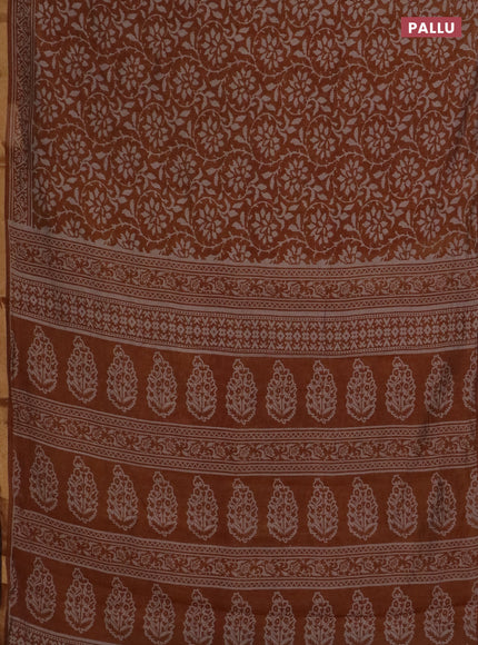 Muslin cotton saree dark mustard with allover prints and zari woven border