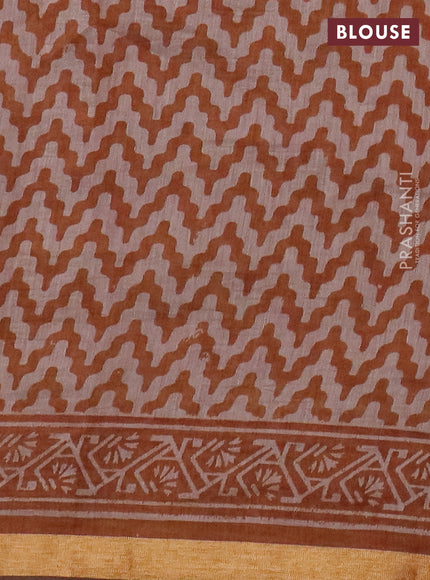 Muslin cotton saree dark mustard with allover prints and zari woven border