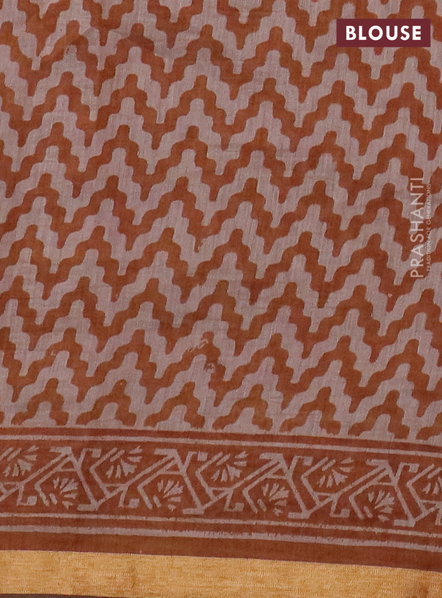 Muslin cotton saree dark mustard with allover prints and zari woven border