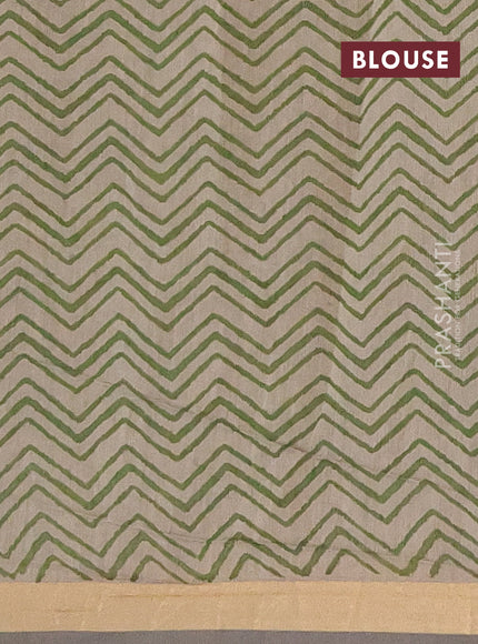 Muslin cotton saree green with allover kalamkari prints and zari woven border