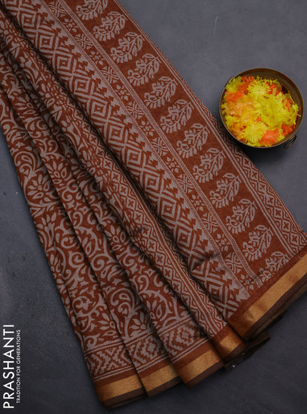 Muslin cotton saree dark mustard with allover kalamkari prints and zari woven border