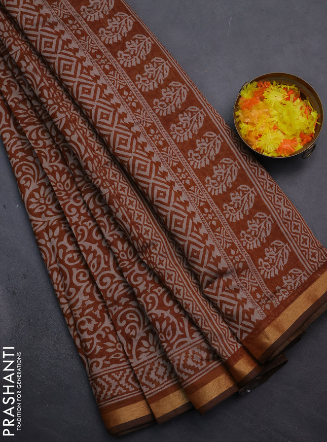 Muslin cotton saree dark mustard with allover kalamkari prints and zari woven border