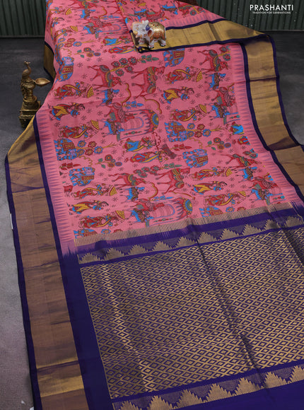 Silk cotton saree peach pink and dark blue with allover kalamkari prints and temple design zari woven border
