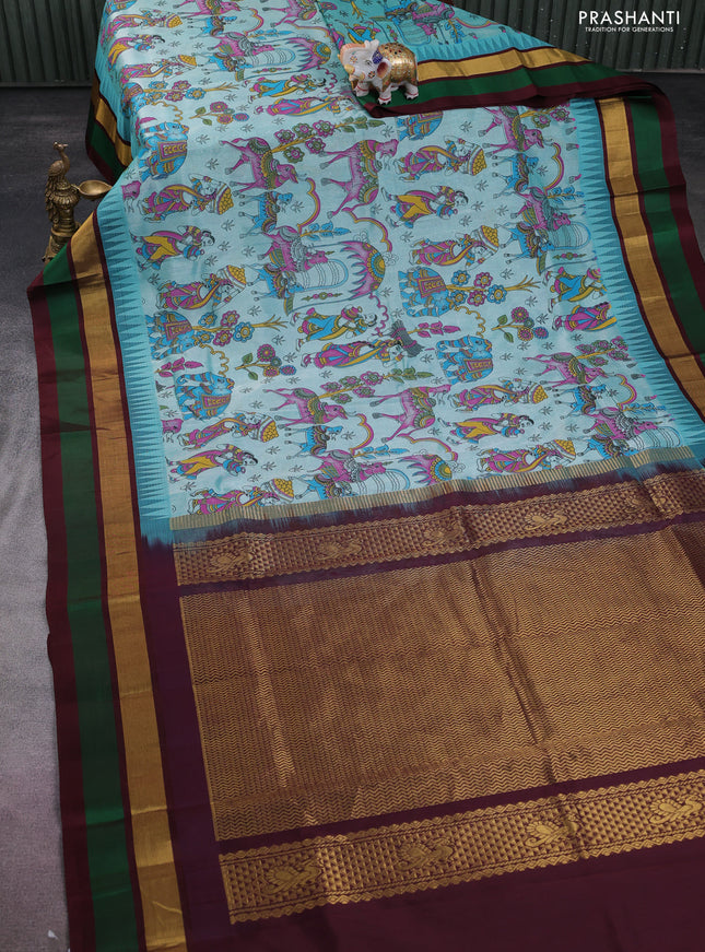 Silk cotton saree teal blue and deep maroon with allover kalamkari prints and temple design zari woven simple border