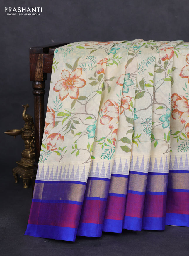 Silk cotton saree cream and blue with allover floral prints and temple design zari woven simple border
