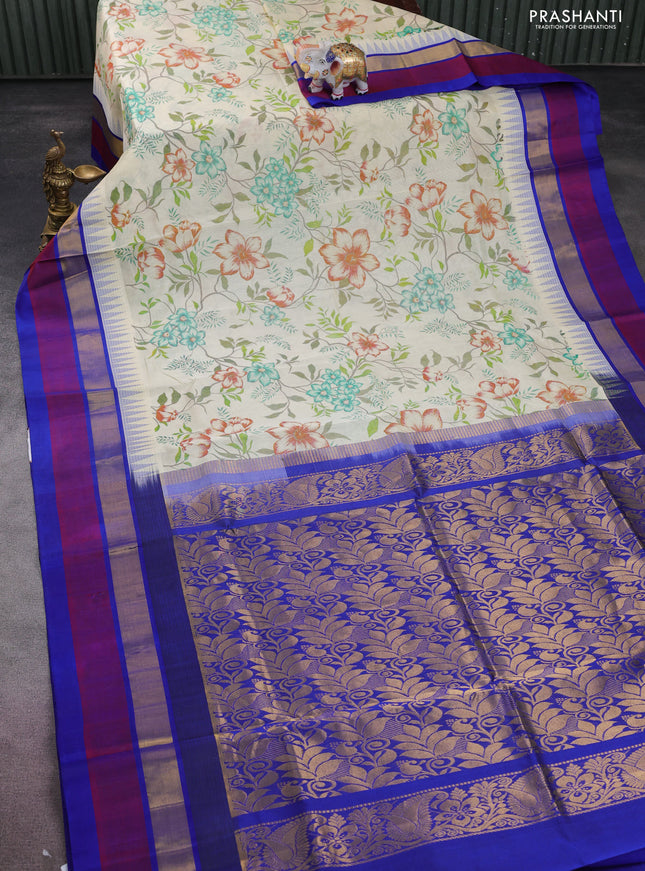 Silk cotton saree cream and blue with allover floral prints and temple design zari woven simple border