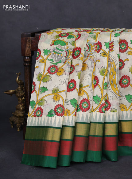 Silk cotton saree cream and green with allover kalamkari prints and temple design zari woven simple border