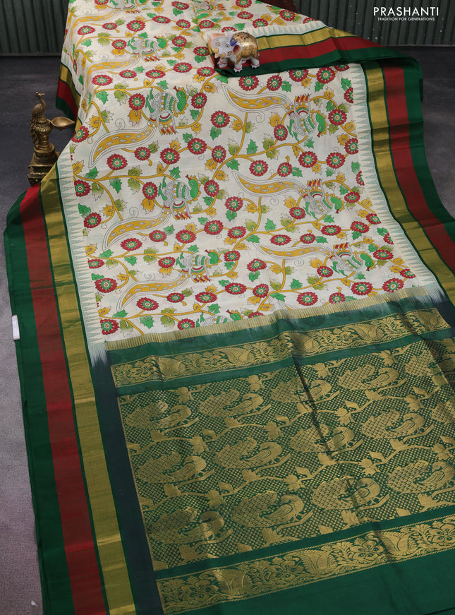 Silk cotton saree cream and green with allover kalamkari prints and temple design zari woven simple border