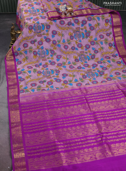 Silk cotton saree mild lavender and purple with allover kalamkari prints and zari woven korvai border