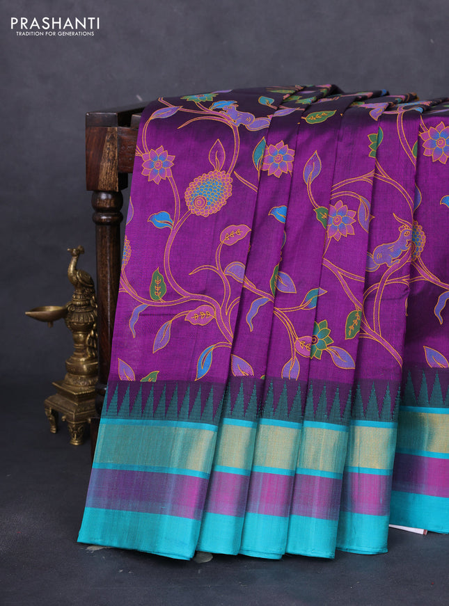 Silk cotton saree purple and teal blue with allover kalamkari prints and temple design zari woven border