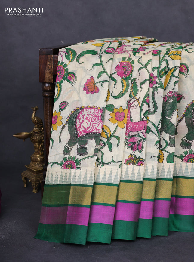 Silk cotton saree cream and green with allover kalamkari prints and temple design zari woven simple border