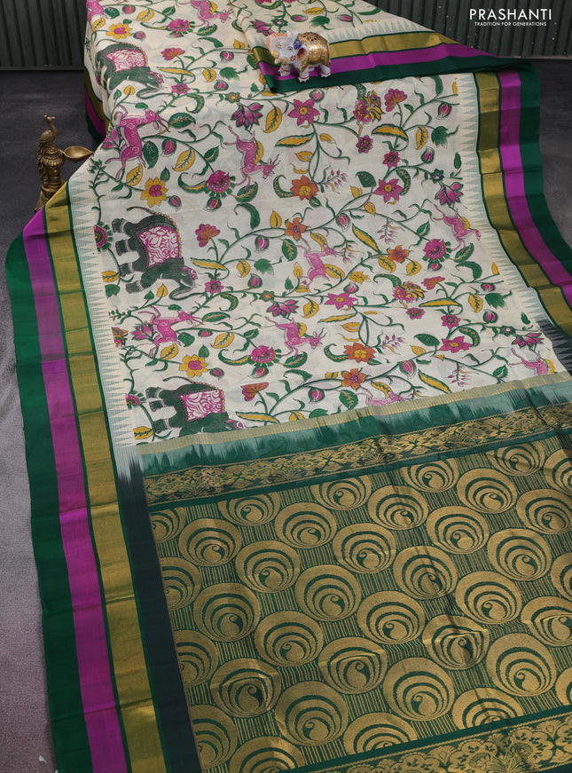 Silk cotton saree cream and green with allover kalamkari prints and temple design zari woven simple border