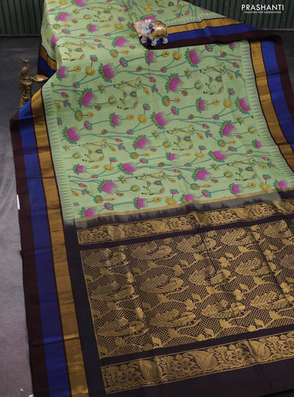 Silk cotton saree pastel green and coffee brown with allover pichwai prints and temple design zari woven simple border