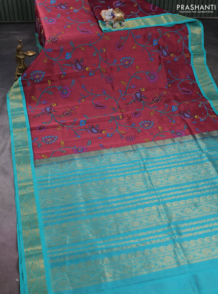 Silk cotton saree deep maroon and teal blue with allover kalamkari prints and zari woven korvai border
