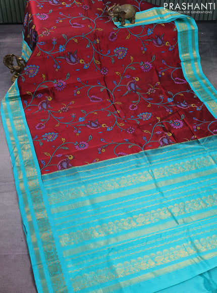 Silk cotton saree maroon and teal blue with allover kalamkari prints and rettapet zari woven korvai border