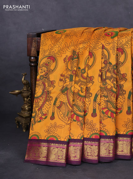 Silk cotton saree mustard yellow and dark magenta pink with allover kalamkari prints and zari woven korvai border