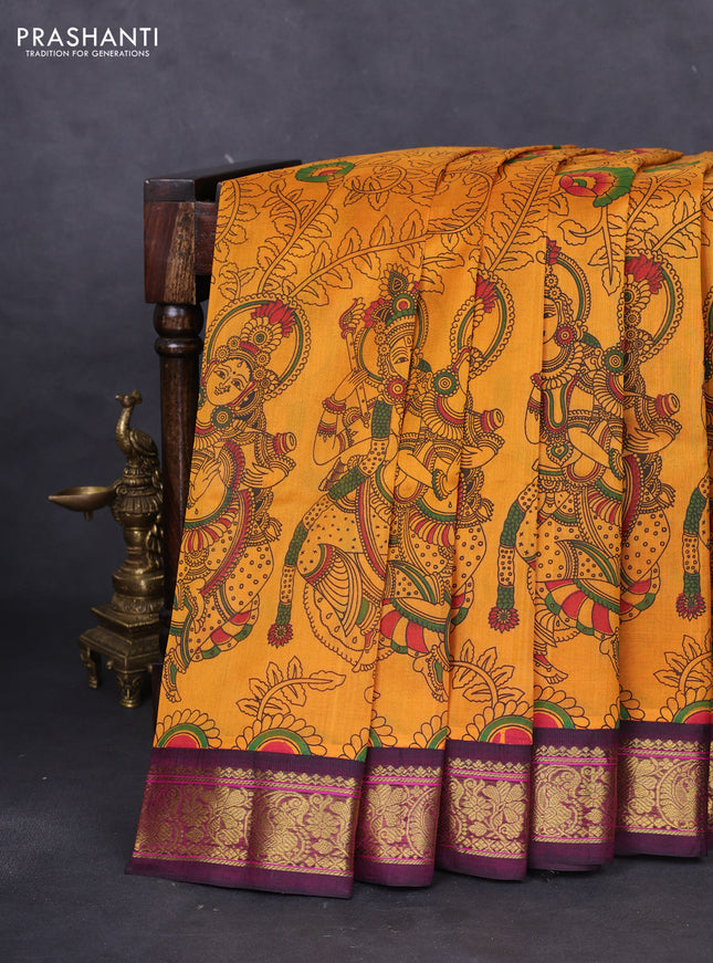 Silk cotton saree mustard yellow and dark magenta pink with allover kalamkari prints and zari woven korvai border