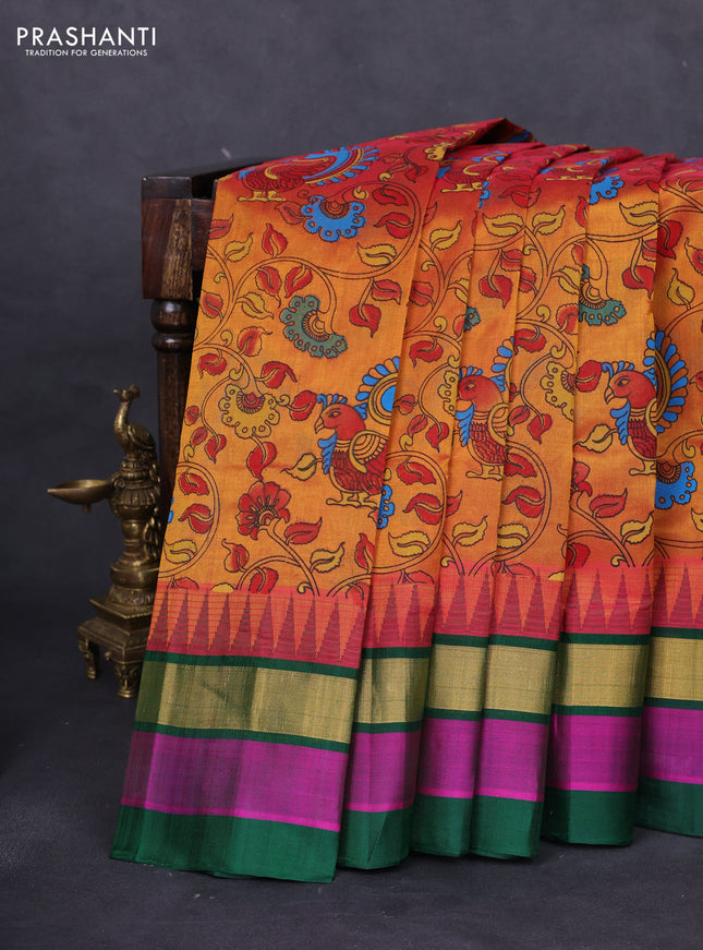 Silk cotton saree dual shade of dark mustard and green with allover kalamkari prints and temple design zari woven simple border