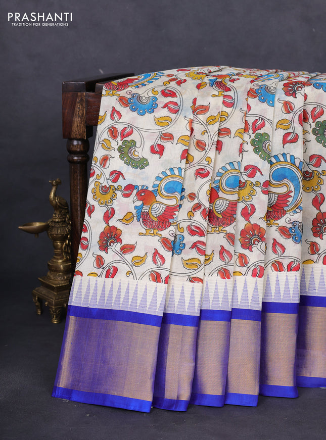 Silk cotton saree cream and blue with allover kalamkari prints and temple design zari woven simple border
