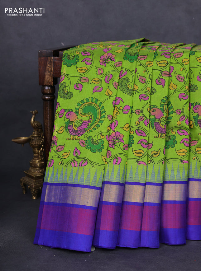 Silk cotton saree parrot green and blue with allover kalamkari prints & zari buttas and temple design zari woven simple border