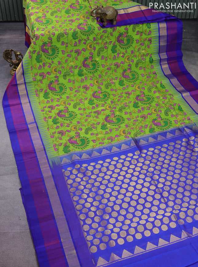 Silk cotton saree parrot green and blue with allover kalamkari prints & zari buttas and temple design zari woven simple border