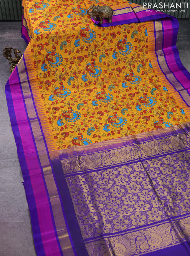Silk cotton saree mustard yellow and blue with allover kalamkari prints and temple design zari woven simple border